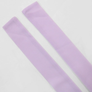 Detail of soft light purple plush over-knee socks with warm coral fleece texture