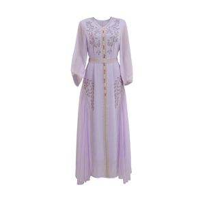 Detailed view of hand-beaded embroidery and sequins on lilac kaftan dress sleeves