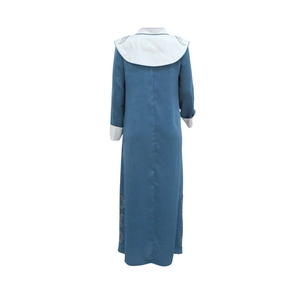 Detail of greyish blue Jalabiya dress with contrasting white collar and sleeve cuffs