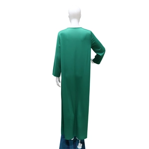 Back view of a long green rhinestone loose maxi dress on a white mannequin