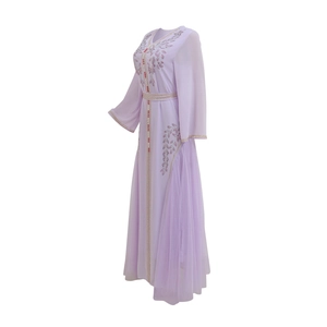 Detail of lavender Kaftan dress featuring intricate sequin embroidery and floral patterns