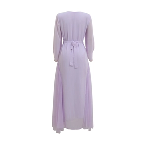 Back view of light purple long-sleeved dress with gold beaded cuffs and mesh hem panels