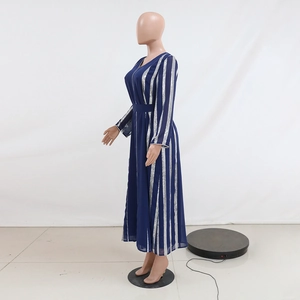 Detail of V-neck long dress in dark blue with silver metallic vertical stripes fabric