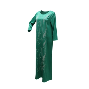 Detail view of emerald green satin abaya with shimmering silver rhinestone wavy patterns