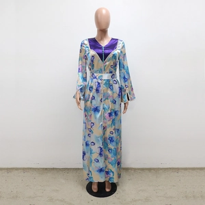 Detail of floral printed kaftan dress with purple satin V-neck and pearl buttons