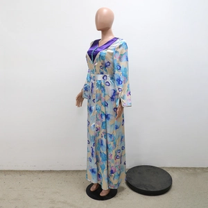 Detail of V-neckline with beadwork and ethnic floral print on long-sleeved abaya dress