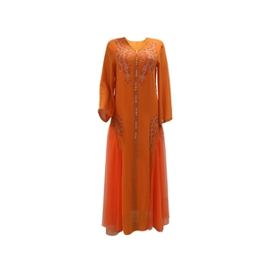Close-up of orange kaftan dress featuring intricate rhinestone embroidery and mesh panels