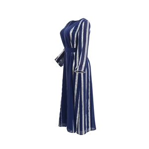 Detail of navy blue chiffon kaftan with shimmering silver sequin stripes and cinched waist