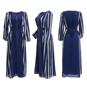 Detailed close-up of dark blue chiffon dress featuring vertical silver sequin stripe patterns