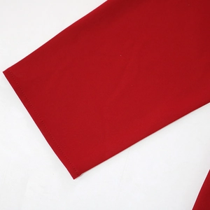 Close-up of the stitching details and fabric texture on a red loose maxi dress