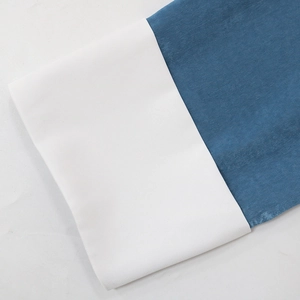 Detail of navy blue satin fabric stitched with a white twill cuff on the jalabiya dress
