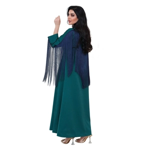 Detail of dark green abaya with long navy blue tassels on shoulders and sleeves