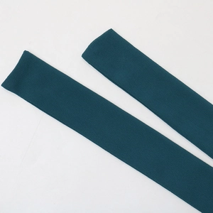 Detailed view of the dark green knitted fabric texture and soft material finish