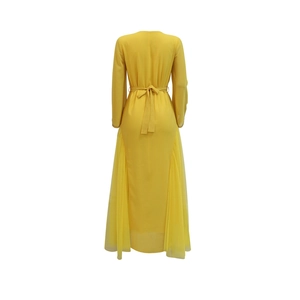 Rear view of yellow mesh dress with waist bow and sheer pleated fabric panels