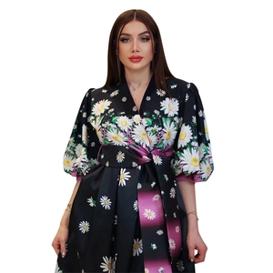 Detail of floral V-neck dress with purple gradient belt and satin puff sleeves