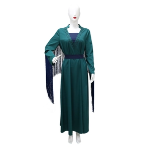 Detailed view of dark green maxi dress with rhinestone tassels and diamond neckline