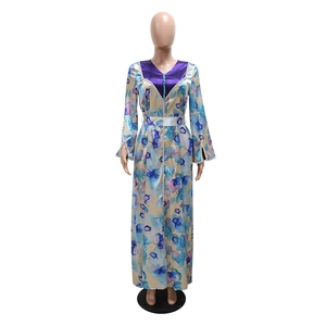 Detailed view of the V-neckline with beadwork and floral patterns on the kaftan dress