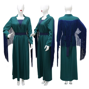 Deep green kaftan dress with beaded V-neckline and dynamic flowing blue tassels