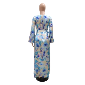 Rear view of long sleeve floral print maxi dress with twist drill beads and waist belt