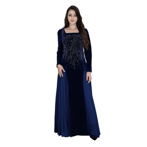 Detail of navy velvet gown featuring exquisite bead embroidery and chiffon pleated side panels