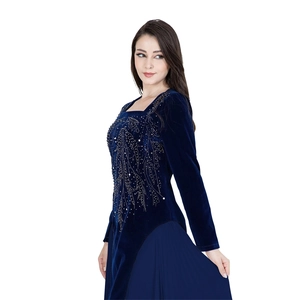 Detail of navy velvet evening dress with delicate beadwork and sequined leaf patterns
