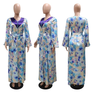 Front, side and back view of long-sleeve floral maxi dress with V-neck and silk belt