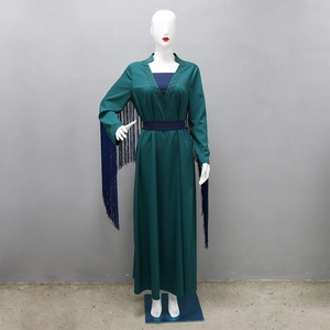 Detail of dark green robe dress featuring long tassels and ethnic geometric patterns
