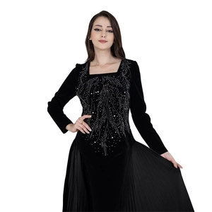 Detailed view of silver rhinestone leaf patterns on black velvet long sleeve Jalabia dress