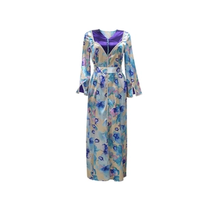 Detail of V-neck Kaftan dress featuring floral prints, satin trim, and decorative buttons