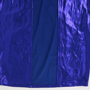 Detailed view of dark blue fabric stitching with metallic purple reflective trim panels