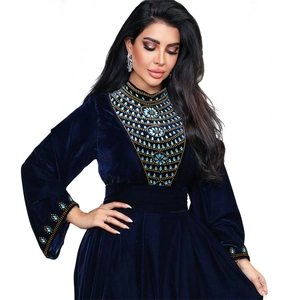 Navy velvet jalabiya evening gown with gold bead embroidery and sequin patterns