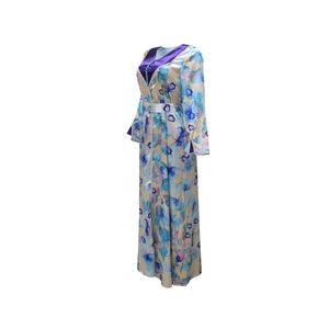Detailed view of Middle Eastern style floral robe dress with lace trim and waist belt
