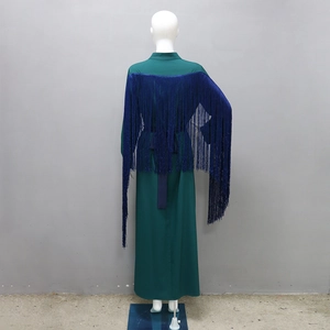 Detail view of deep green robe back featuring luxury navy blue rhinestone fringe accents
