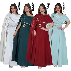 Detail of elegant satin evening gowns with asymmetrical capes and rhinestone belts in 4 colors