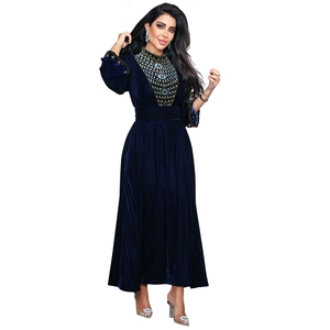 Detailed close-up of ethnic bead embroidery and sequins on navy blue velvet evening gown