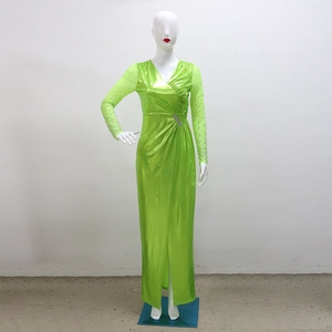 Detailed view of the waist folds with rhinestone buckle on fluorescent green evening gown