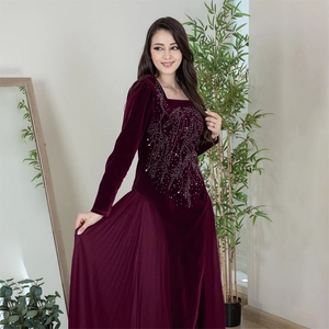 Detailed silver rhinestone embroidery on elegant long sleeve burgundy velvet party dress