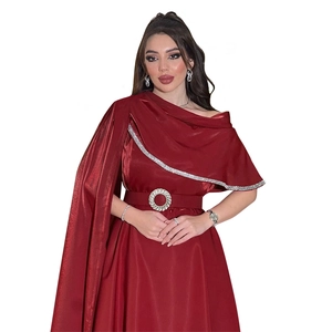 Detail of burgundy satin dress with one-shoulder cape and rhinestone buckle belt
