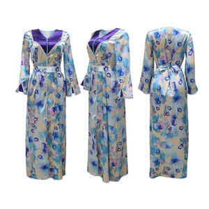 Three-way view of long-sleeve floral dress with pearl buttons and orchid pattern print