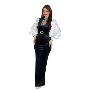 Elegant black velvet evening gown with white satin lantern sleeves and rhinestone belt