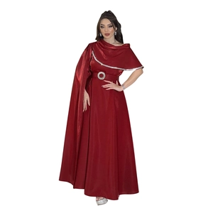 Detail of dark red satin evening gown featuring rhinestone belt and cape shoulder design