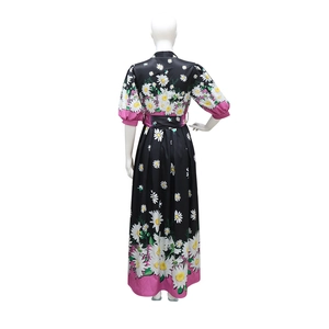 Detail of V-neck back design and pink patchwork hem on daisy print floral maxi dress