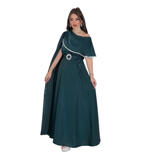 Detail of emerald green satin gown with rhinestone trim and crystal buckle belt