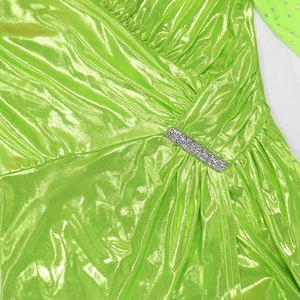 Detailed view of neon green evening gown with crystal waist buckle and draped fabric pleats