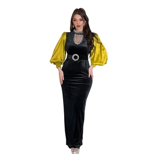 Detail of velvet dress showing rhinestone collar, hollow cutout and lantern sleeves