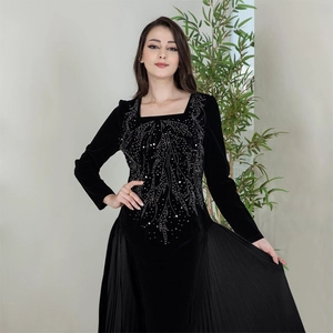 Elegant black velvet long sleeve Jalabia evening gown with rhinestones and pleated detail