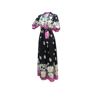 Detail of V-neck wrap dress with daisy floral print and pink drawstring waist belt