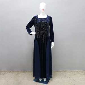 Macro detail of intricate rhinestone leaf patterns on Navy Blue velvet evening Jalabia dress