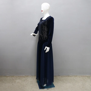 Detail of the navy blue velvet gown with sparkling rhinestone accents and chiffon skirt