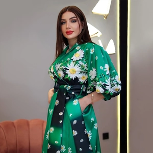 Elegant green satin dress with white daisy floral print and stylish puffy sleeves
